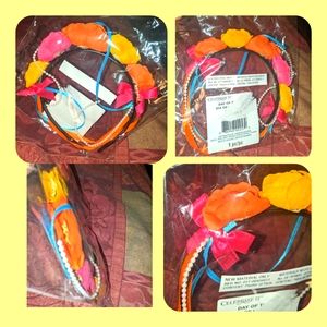 5/$25 day of the Dead themed headband, still sealed in original bag
